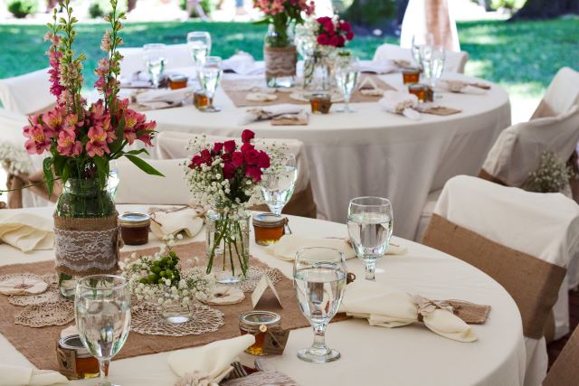 a table set for an outdoor wedding